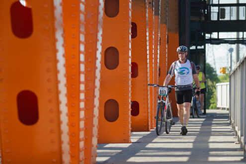 Cyclists walking on the Burlington Lift Bridge